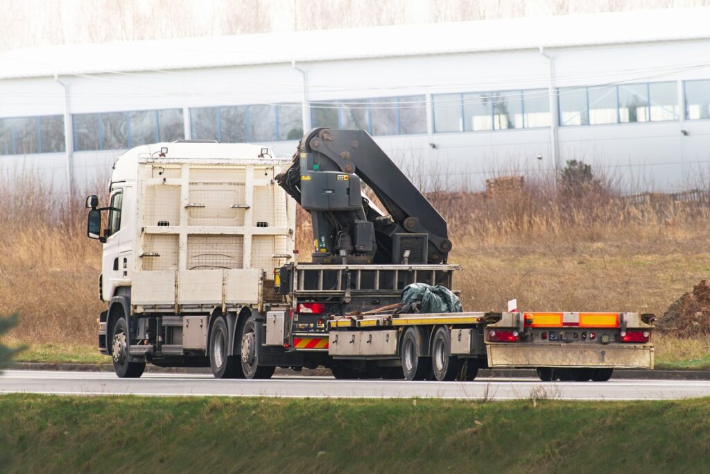 Industrial Excavator and Flatbed Truck Ready for Earthworks
